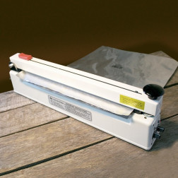 Impulse sealer with holding magnet and cutter